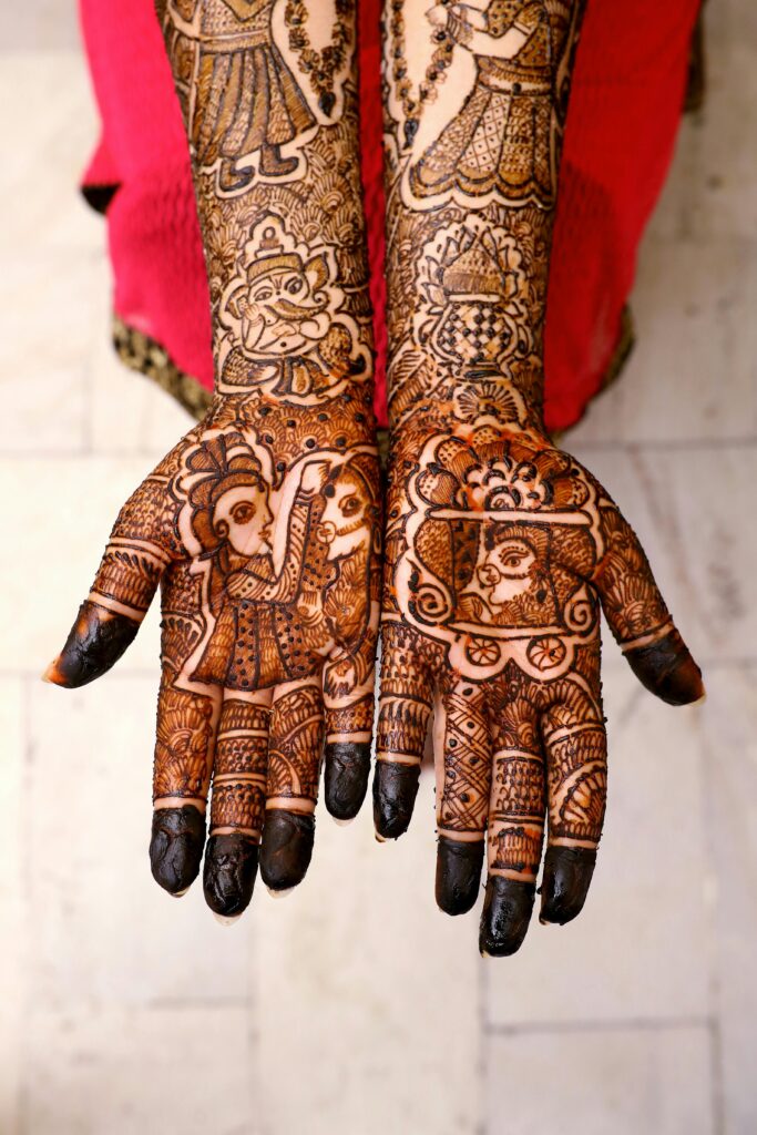 pexels photo 2114229 2114229 Beautiful mehndi art covers the hands of an adult woman, showcasing traditional cultural patterns.